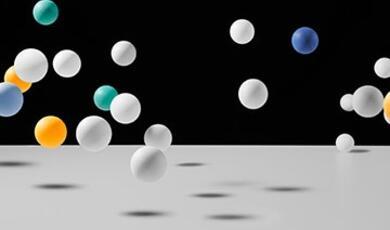 coloured balls bouncing on white surface