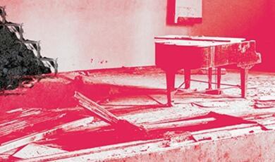 Lone piano on crumbling stage