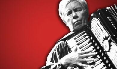 Photo of Pauline Oliveros against red background