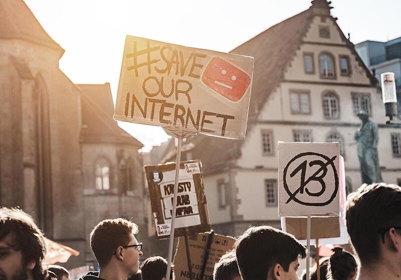a group of protestors with placards
