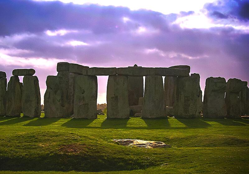 Stonehenge against a purple cloudy sky