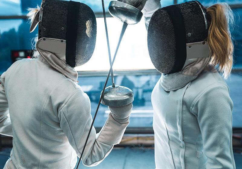 Two fencers with swords touching
