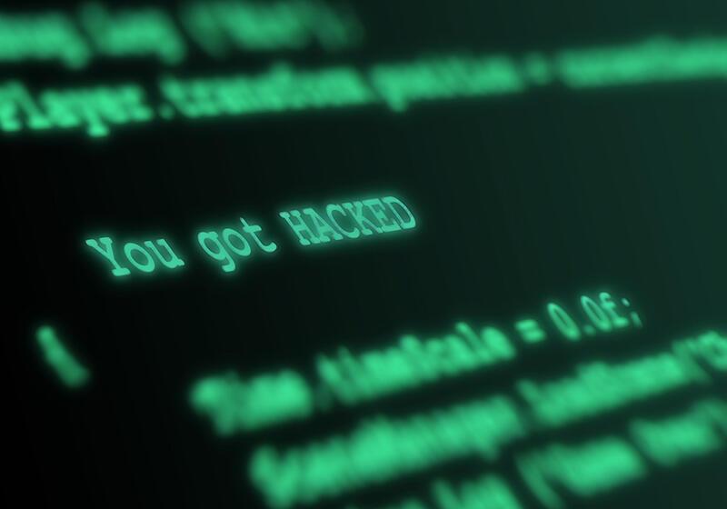 green text code on a computer screen with the words 'You got HACKED' visible