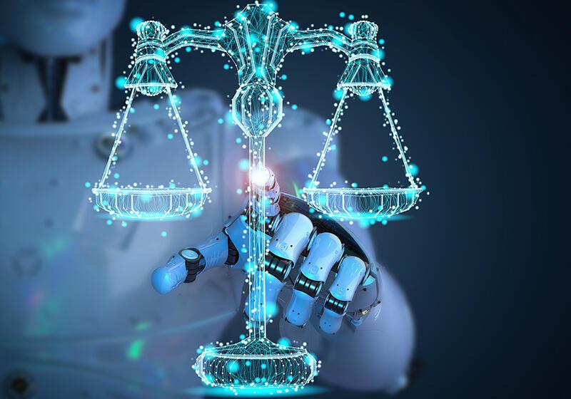 Robot pointing at neon outline of a set of scales