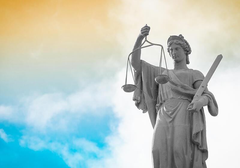 Statue of Lady Justice holding scales and sword