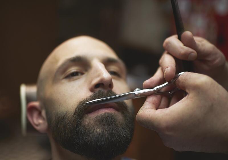 Man having his beard trimmed