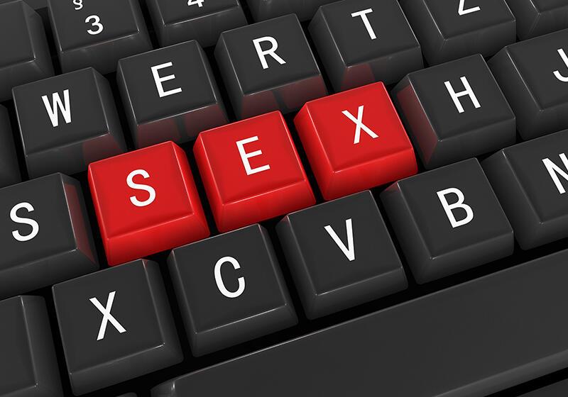 the word 'sex' highlighted in red on a keyboard