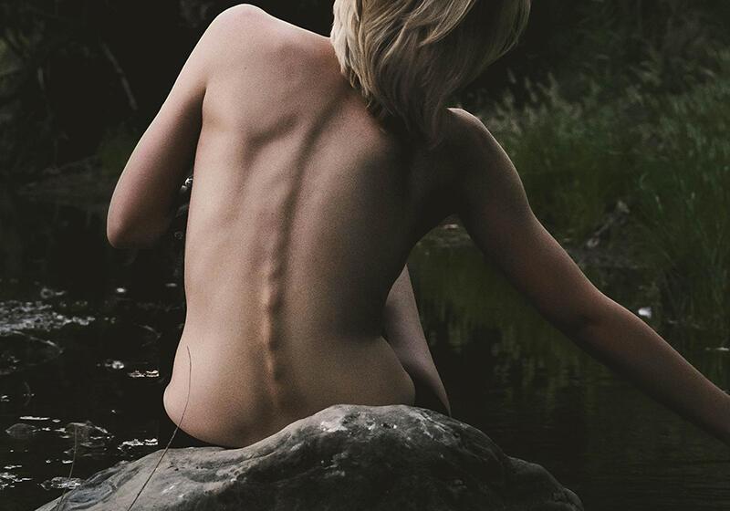 a naked back of a woman