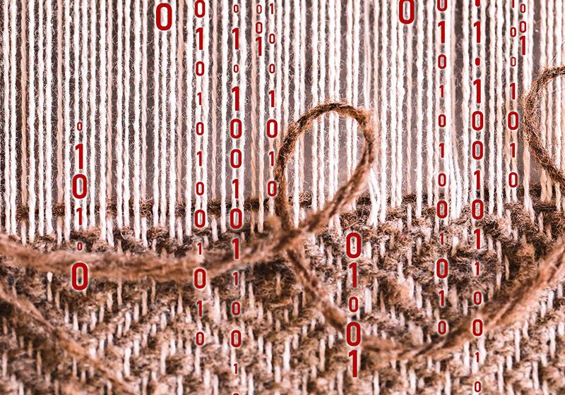 Close up of weaving on loom with computer code floating over the top