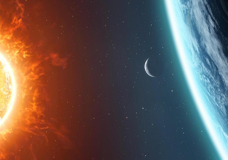 Sun, Earth, and Moon seen from space with a starry background.