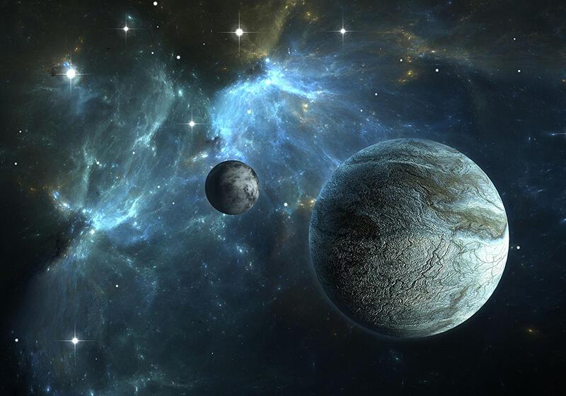 Two planets against a backdrop of a glowing blue nebula and scattered stars