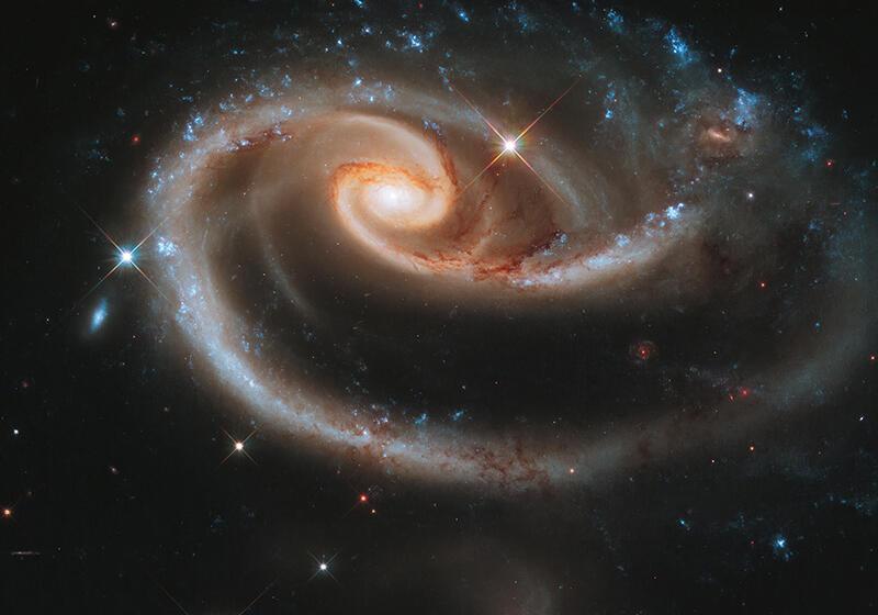 Interacting spiral galaxies Arp 273, with the larger galaxy tidally distorted into a rose-like shape by its companion