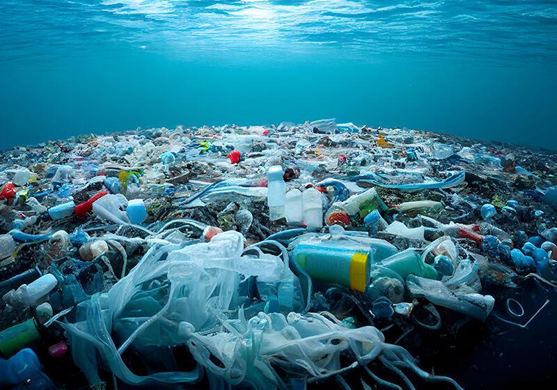 Underwater view of a vast accumulation of plastic pollution in the ocean