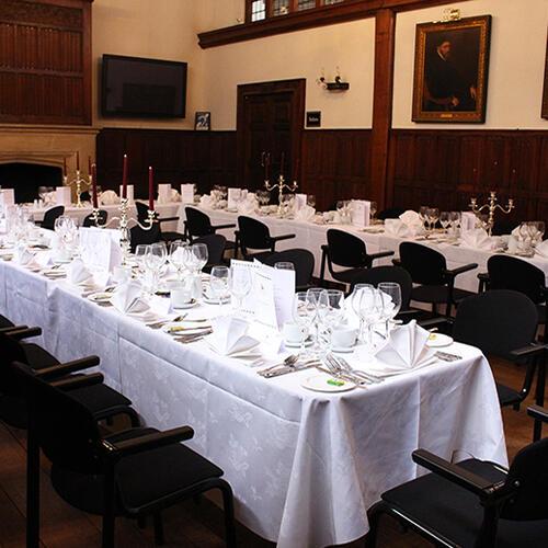 Barnard's Inn main Hall set up for a sit-down meal with long table layout