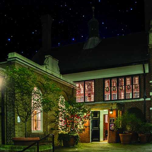 Exterior of Barnard's Inn at Christmas time with lights