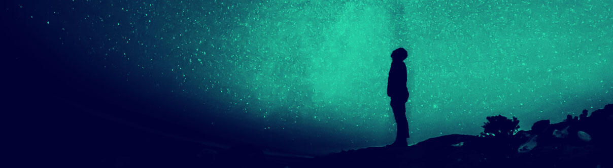 Man looking at a starry sky