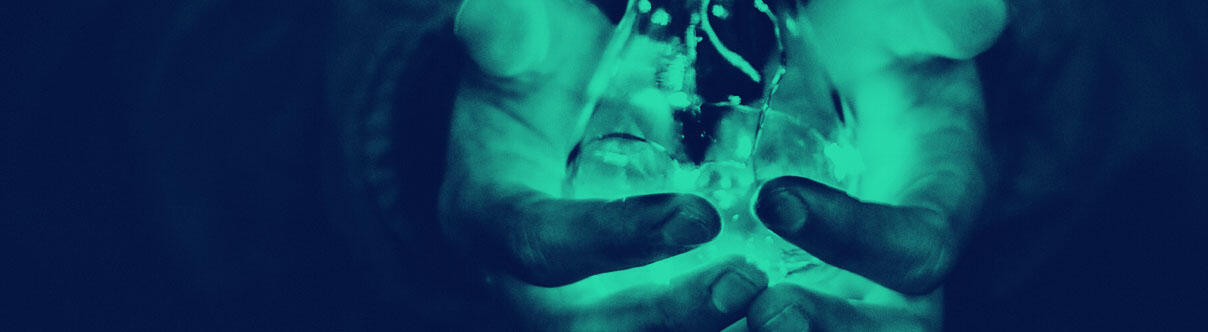 Hands holding a light bulb