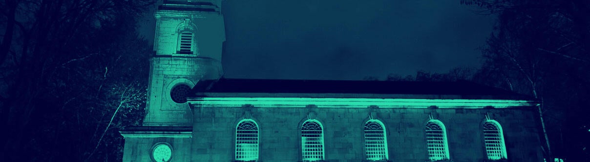 Exterior of LSO St Luke's showing hall and tower at night