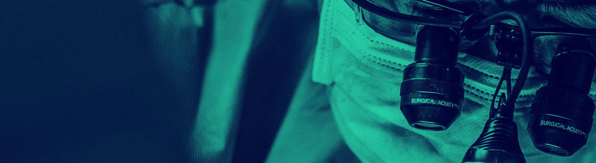 Close up of surgeon wearing loupes during operation