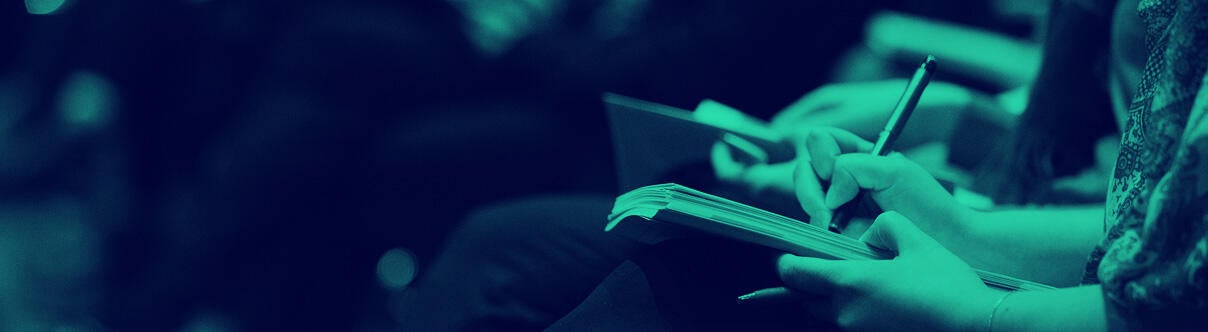 close up of journalists writing in notepads