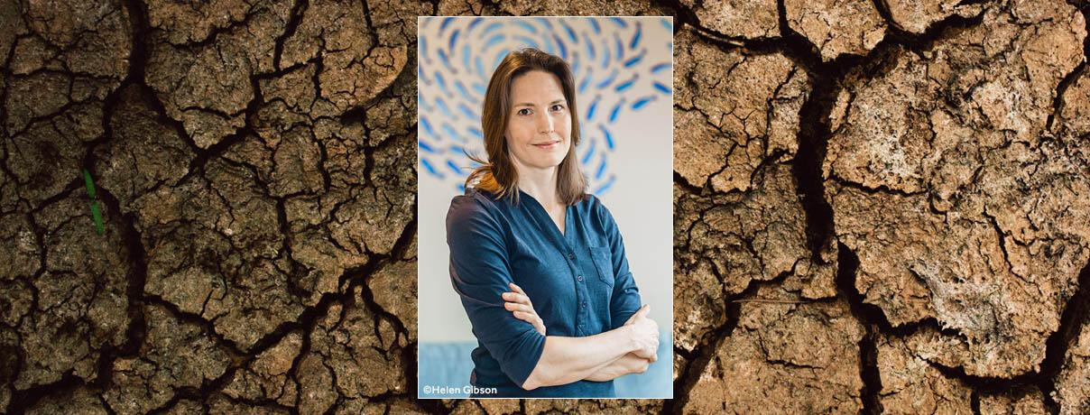 Helen Czerski on a backgroun of cracked, parched earth