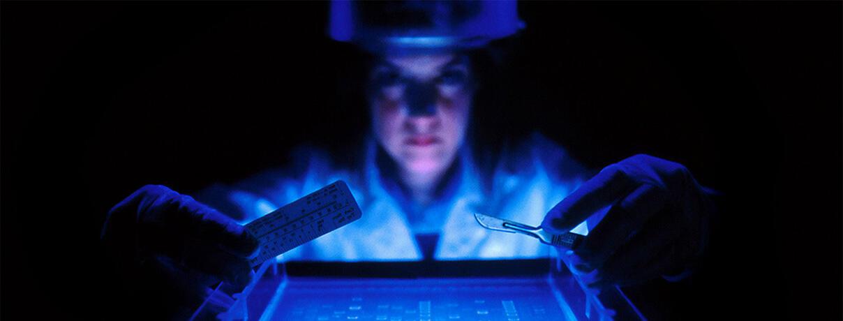 Medical scientist examining DNA