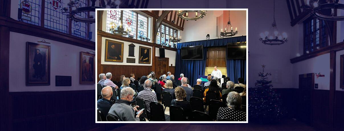 Visitors listening to a lecture on the history of Gresham College and Barnard's Inn