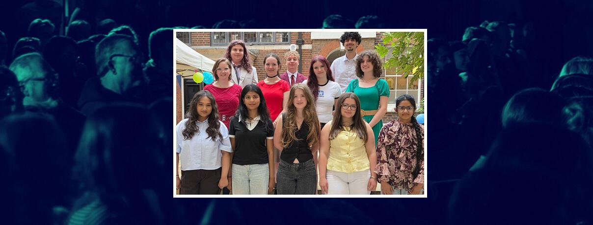 Group photo of the 12 finalists outside in our courtyard