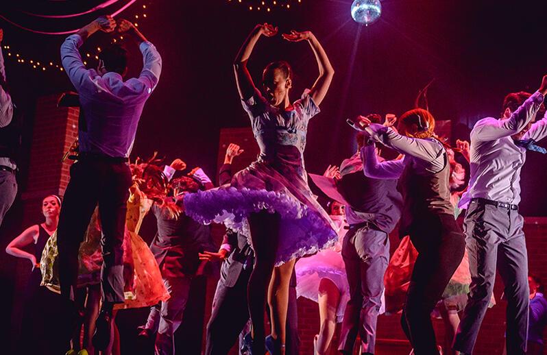 Stylised blue-green photos of a monk, a pixellated dog, a close-up spore, a person on a hill, a toy robot and a banana wrapped in chains