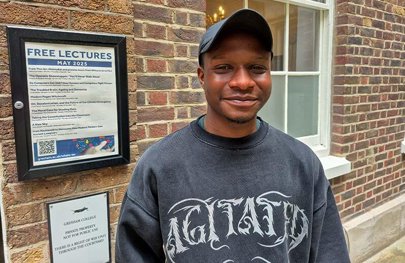 Hands holding a light bulb