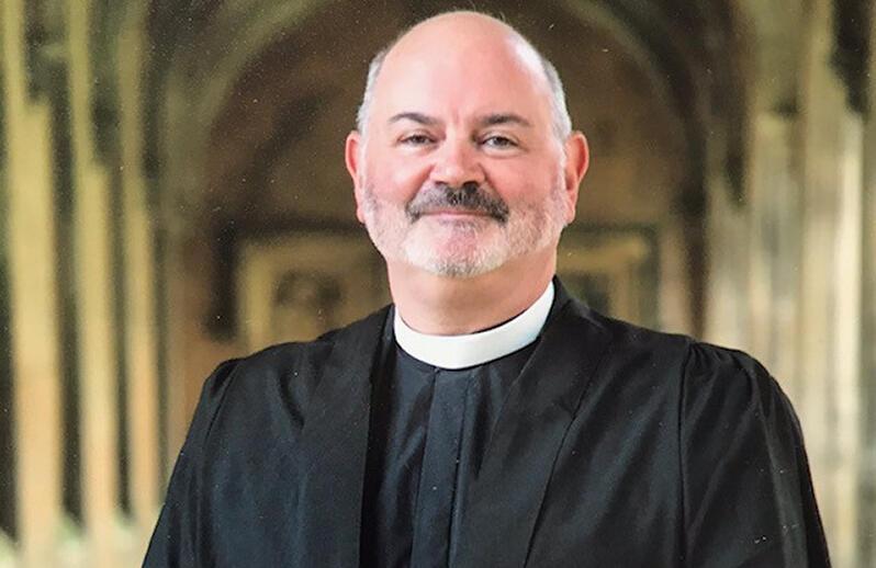 Hands holding a light bulb