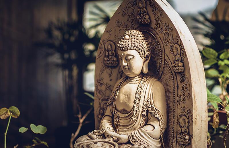 Buddha statue in garden setting