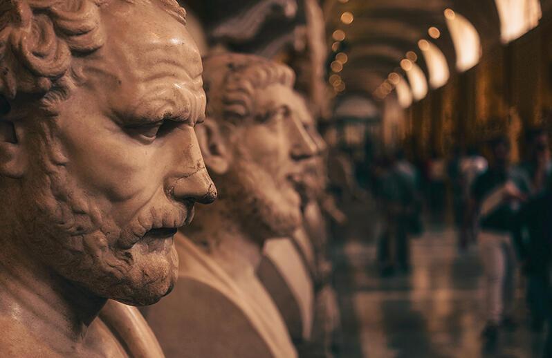 close up of row of faces and busts from antiquity