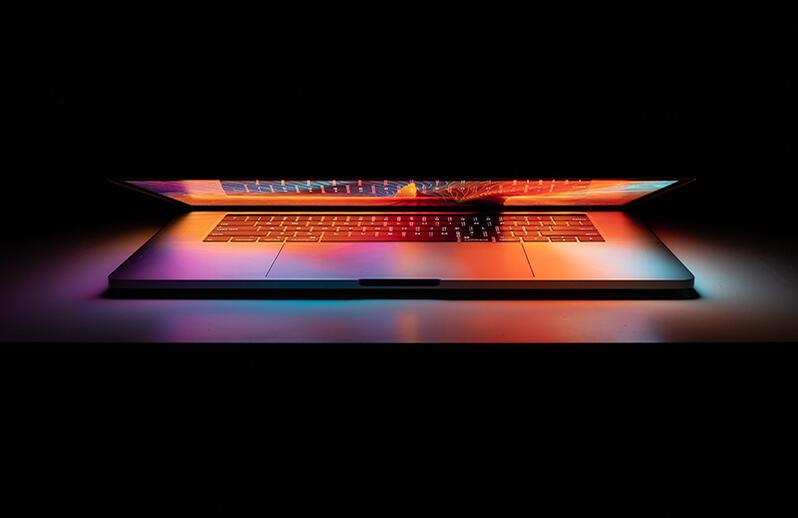 Lap top slightly open with glimpse of screen