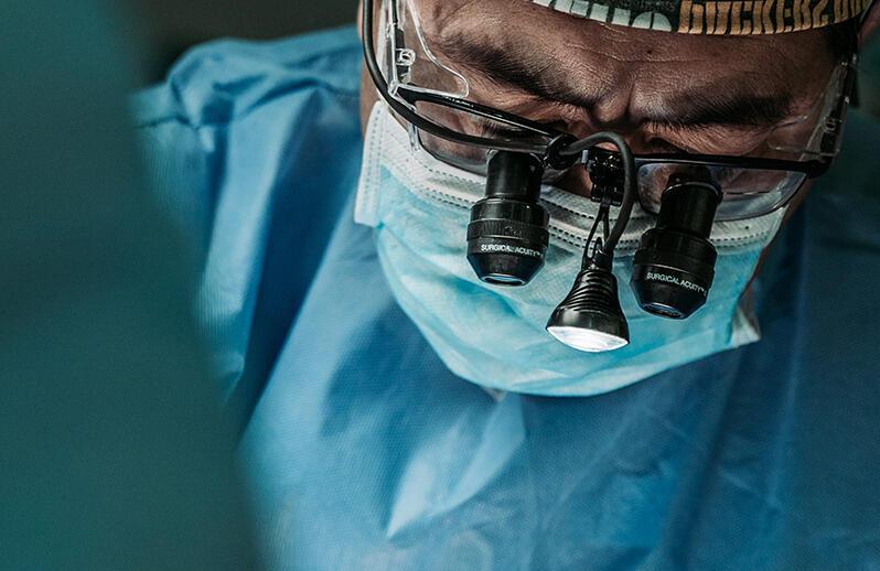 Close up of surgeon wearing loupes during operation