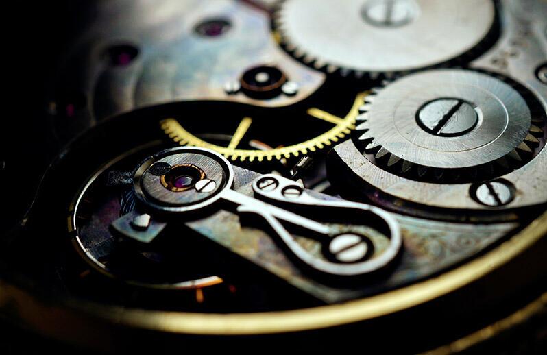 blue and green image, inside mechanism of a clock or watch