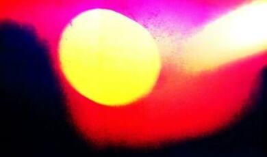 Yellow dot on red and black background