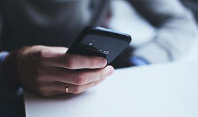 Male hand holding phone
