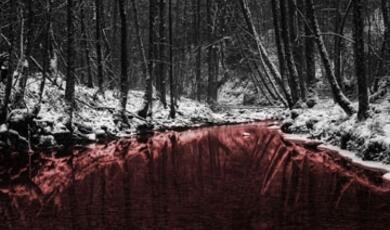 A snow-covered forest with a red river