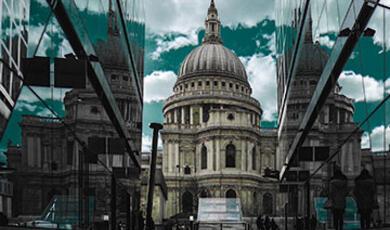 Exterior of St Paul's Cathedral in between skyscrapers