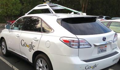 A white Google self-driving car