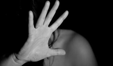 Black and white photograph of hand in front of someone's face