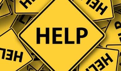 Collage of yellow warning signs that read 'HELP'