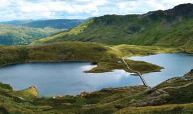 A lake surrounded by hills