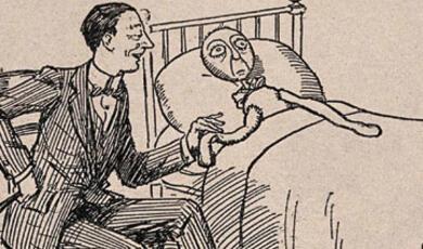 A doctor in a suit sitting beside a bed and holding the hand of a doll lying in the bed