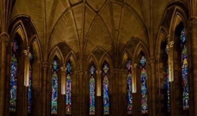 Image of a church interior with stained glass windows