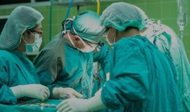 Surgeons working on patient
