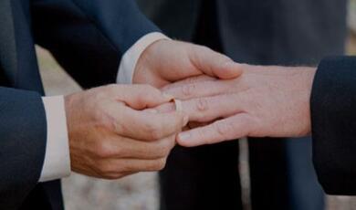 Couple exchanging rings