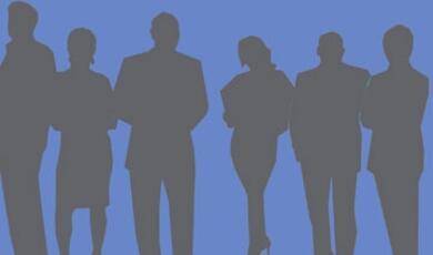 Silhouettes of people against blue background