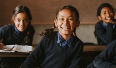 schools girls at desks in developing country